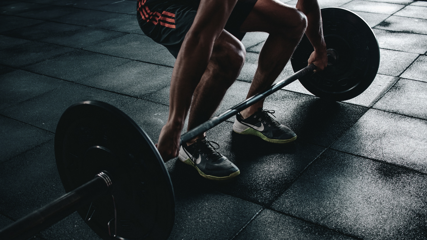 Image of person deadlifting with a  barbell